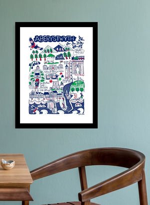 Aberwystwyth pretty little seaside art print by British illustrator Julia Gash. This popular tourist destination and surfing spot in Wales is depicted by Julia in her iconic spirited style as beautiful wall decor for your home